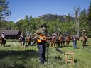 Singer Corb Lund, centre, sings on land proposed for coal mine development in the eastern slopes of the Livingstone range south west of Longview, Alta., on June 16, 2021.