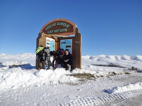 Laval St. Germain posing with his bike at the Arctic Circle. Photo courtesy Laval St. Germain