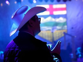 UCP supporters file into the Big Four Building in Calgary on Monday.