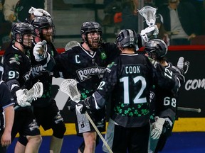 The Calgary Roughnecks celebrate a goal by Jesse King against the Saskatchewan Rush on Westjet Field at Scotiabank Saddledome in Calgary on March 17, 2023.