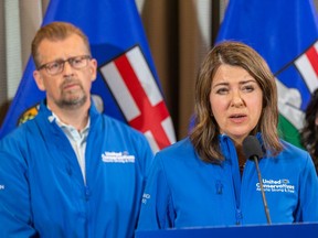 United Conservative Party Leader Danielle Smith makes an announcement to improve public safety as Calgary West UCP candidate Mike Ellis listens on Tuesday, May 9, 2023 in Edmonton.