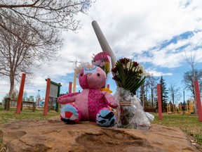 A memorial to a mother and her 11-year-old child who were fatally stabbed near Crawford Plains School in Edmonton is seen on May 6.