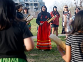 The Stardale Girl Drummers practice at Bridgeland park for Friday's Red Dress Day Ceremony in Calgary on May 3.
