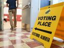 A man enters a polling station at Wildwood School in the riding of Calgary-Bow during the Alberta election on Monday.