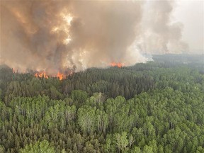 A view of wildfire HWF-030 near the community of Fox Lake in northern Alberta on Sunday, May 14.