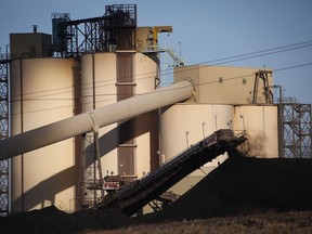 A conveyor belt transports coal at the Westmoreland Coal Company's Sheerness Mine near Hanna, Alta., Tuesday, Dec. 13, 2016. An environmental group is calling for improvements after Alberta's energy regulator announced that heavy rain had caused flooding and excessive surface runoff at energy sites, including coal mines.
