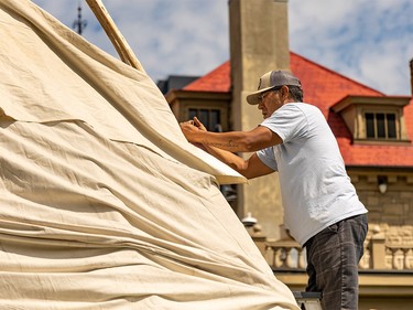 Kainai First Nation members raise a tipi as part of celebrating National Indigenous Peoples Month at Lougheed House on Sunday, June 25, 2023.