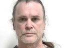 Leonard Brian Cochrane is charged in the 1994 shooting deaths of Barry Buchart and Trevor Deakins.