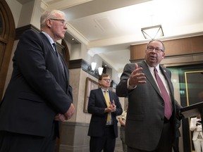 Emergency Preparedness Minister Bill Blair (left) listen to United States Ambassador to Canada David Cohen as they speak in the Foyer of the House of Commons on Thursday, June 22, 2023 in Ottawa.