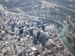Downtown Calgary and the Bow River are seen from the air on Wednesday, May 31, 2023. The Calgary Real Estate Board says the market hit a new May record for sales last month as the number of properties that changed hands reached 3,120.
