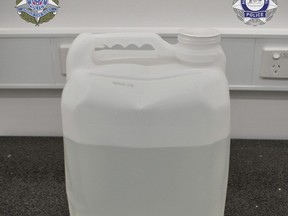 In this undated photo provided by the Australian Federal Police a jug alleged to contain methamphetamine is displayed in Melbourne. A drug syndicate that tried to smuggle tons of methamphetamine from Canada to Australia and New Zealand by hiding it in shipments of maple syrup and canola oil has been busted, authorities said Thursday, June 15.