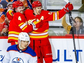 Mikael Backlund celebrates with teammate Rasmus Andersson after scoring against the Edmonton Oilers in NHL hockey at the Scotiabank Saddledome in Calgary on Tuesday, December 27, 2022.