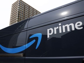 FILE - An Amazon Prime delivery vehicle is seen in downtown Pittsburgh on March 18, 2020. The Federal Trade Commission sued Amazon on Wednesday for what it called a years-long effort to enroll consumers without consent into its Prime program and making it difficult for them to cancel their subscriptions.