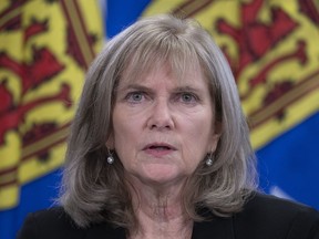 Nova Scotia auditor general Kim Adair fields questions at a news conference in Halifax on Tuesday, Nov. 23, 2021. Adair has found an employment services organization mismanaged $1 million in government funds.