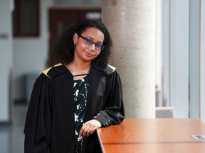 Anthaea-Grace Patricia Dennis poses for a portrait at the University of Ottawa in Ottawa on Friday, June 2, 2023. The 12-year-old is graduating from the University of Ottawa's biomedical science program, and setting a record in the process.