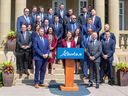 Alberta Premier Danielle Smith poses for a picture with members of her cabinet on Friday, June 9.