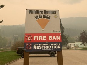 Blairmore area wildfire warning signage is shown in this handout image provided by the Government of Alberta Fire Service. As fire bans continue in many provinces, businesses selling camping gear and firewood are seeing a shift in demand.