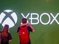 Visitors take a photo of the Xbox logo at the Gamescom video game fair in Cologne on August 24, 2022.