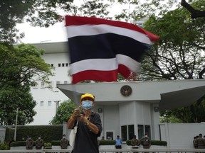A Royalist protester waves a Thai national flag in front of the U.S. Embassy in Bangkok, Thailand, on May 24 , 2023. The U.S. ambassador to Thailand dismissed claims of American interference in recent elections as a "disservice" to the Thai people, saying Tuesday, June 27, 2023 that Washington does not support any individual candidate or political party.
