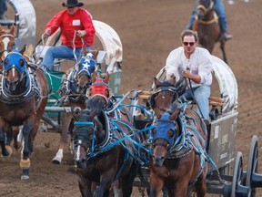 Chanse Vigen hits the finish in Heat 9 of the Cowboys Rangeland Derby during the Calgary Stampede on Friday, July 7, 2023.