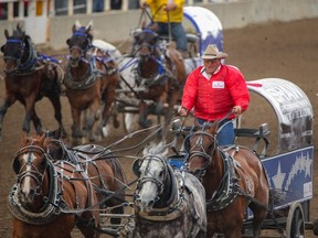 Kirk Sutherland comes at the finish in Heat 2 at the Rangeland Derby chuckwagon races at the Calgary Stampede on Sunday, July 9, 2023. Mike Drew/Postmedia