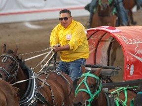 Preston Faithful heads to the finish in Heat 4 of the Rangeland Derby chuckwagon races at the Calgary Stampede on July 15.