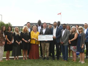 Public Safety Minister Marco Mendicino gathers with dignitaries and George Chahal, Liberal MP for Calgary Skyview after announcing funding to prevent gun crime and gang violence in Calgary on Wednesday, July 12, 2023.