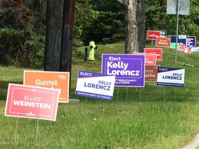 Candidates' signs line 24 St. S.W. in Woodbine in Calgary on Thursday, July 20, 2023, in advance of the Calgary Heritage byelection, to be held on July 24, 2023.