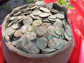 Close to 5,000 coins were found in the Romanian forest by a hobbyist.