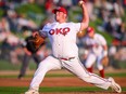 OKOTOKS, AB - MAY 26, 2023: The Okotoks Dawgs' Matt Wilkinson pitches against the Brooks Bombers at Seaman Stadium. Angela Burger/Okotoks Dawgs