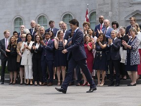 Prime Minister Justin Trudeau walks to a group photo opportunity with his new cabinet following a swearing-in ceremony at Rideau Hall in Ottawa on Wednesday, July 26, 2023.