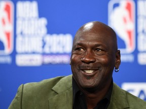 In this file photo taken on January 24, 2020 former NBA star and owner of Charlotte Hornets team Michael Jordan looks on as he addresses a press conference ahead of the NBA basketball match between Milwaukee Bucks and Charlotte Hornets at The AccorHotels Arena in Paris.