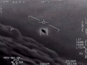 In this file photo taken on April 28, 2020 this video grab image courtesy of the US Department of Defense shows part of an unclassified video taken by Navy pilots that have circulated for years showing interactions with 'unidentified aerial phenomena'
