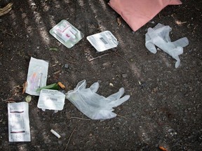 FILE: In this file photo taken on June 25, 2020 a drug syringe and nasal overdose prevention drug can be seen near a popular drug spot in Ottawa, Ontario.