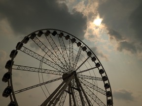 Smoke behind the Stampede Ferris wheel