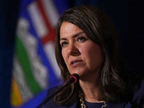 Alberta Premier Danielle Smith responds to a question during a news conference after a meeting of western premiers, in Whistler, B.C., on Tuesday, June 27, 2023. CBC News is retracting a report from January alleging someone in Premier Danielle Smith's office emailed prosecutors to question the handling of cases involving a COVID-19 protest at a U.S. bordering crossing.
