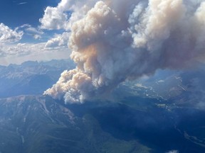 This July 24, 2023, handout image released by the British Columbia Wildfire Service, shows an aerial view of the Horsethief Creek wildfire, approximately 10kms (6.2 miles) west of Invermere, British Columbia, Canada.
