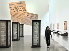Curator Catherine Clement in the Chinese Canadian Museum exhibition commemorating 100 years since the passing of the 1923 Chinese Exclusion Act.