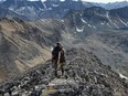 Geology graduate Ryan Burke at the property in Yukon that he discovered and that could one day pay him millions if confirmed to hold rich gold, silver and copper deposits. Burke won a contest for recent geology grads and students for his mine proposal — then struck a deal with an actual mining company.