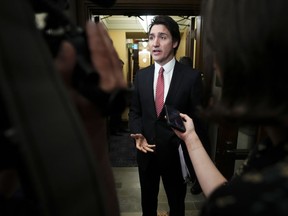 Prime Minister Justin Trudeau speaks to reporters in the foyer of the House of Commons on Parliament Hill in Ottawa on Tuesday, June 20, 2023.