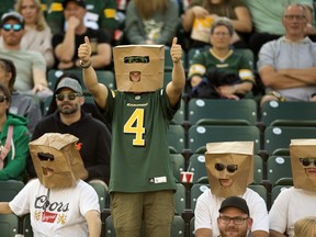 The Edmonton Elks' fans wear paper bags on their heads while watching the Elks battle the B.C. Lions during first half CFL action at Commonwealth Stadium, in Edmonton Saturday July 29, 2023.