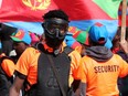 A riot broke out between pro government Eritrean supporters (pictured in orange) and anti-Eritrean government protesters at the Rosslyn Park soccer fields, 113A Street and 132 Avenue, on Saturday, Aug. 19, 2023.