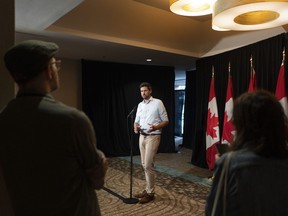 Sean Fraser, Minister of Housing, Infrastructure and Communities, speaks to reporters during the Liberal cabinet retreat in Charlottetown, Monday, Aug. 21, 2023.