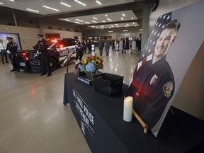 Guests arrive for the Celebration of Life service for Fargo Police Officer Jake Wallin at Scheels Arena on Wednesday, July 26, 2023 in Fargo. N.D.. Wallin was killed July 14 when a man armed with 1,800 rounds of ammunition, multiple guns and explosives ambushed officers responding to a routine traffic crash.