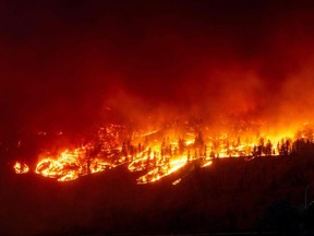 The McDougall Creek wildfire burns in the hills in West Kelowna, B.C.