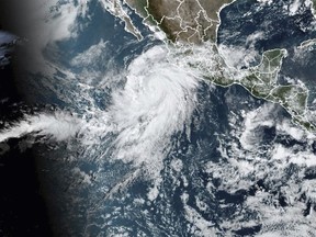 This satellite image taken at 10:50am EDT on Thursday, Aug. 17, 2023, and provided by the National Oceanic and Atmospheric Administration (NOAA) shows Hurricane Hilary off the Pacific coast of Mexico. (NOAA via AP)