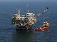 FILE - A rig and supply vessel are pictured in the Gulf of Mexico, off the cost of Louisiana, April 10, 2011. The Biden administration's plan to protect an endangered species of whale by scaling back an auction of oil and gas drilling leases in the Gulf of Mexico is being challenged by the oil industry. The conflicting federal lawsuits -- one filed Thursday, Aug. 24, 2023, in southwest Louisiana by oil interests, the other announced Friday, Aug. 25, in Washington by the organization Earthjustice -- focus on a planned sale of oil and gas leases set for Sept. 27 in New Orleans.