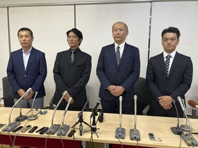 From left: Lawyer Kazuya Sugiyama, Junya Hiramoto, Shimon Ishimaru and Yukihiro Oshima speak to reporters at a Tokyo office Monday, Aug. 14, 2023. Hiramoto and Ishimaru who say they were sexually abused as children by a Japanese entertainment mogul spoke Monday with a special team set up by the talent agency to look into the allegations.