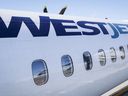 WestJet says it's adjusting prices and adding capacity to help with evacuation efforts from Yellowknife. A WestJet plane waits at a gate at Calgary International Airport in Calgary, Alta., Wednesday, Aug. 31, 2022.THE CANADIAN PRESS/Jeff McIntosh