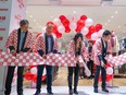 The ribbon is cut at the opening of the Uniqlo store in Chinook Centre on Friday, August 25, 2023.